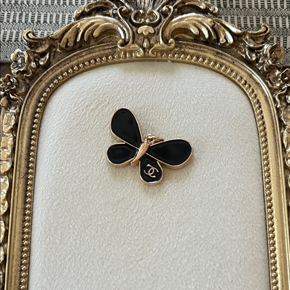 CHANEL Black and Gold Butterfly pendant